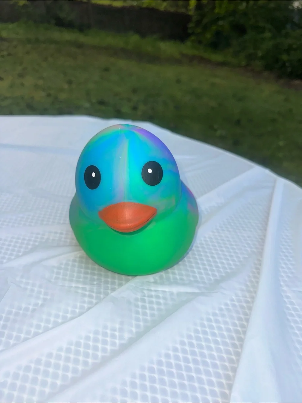 ONE Sunny Days Squeeezy tiedye duck jumbo squishy squeezy fidget toy multicolor